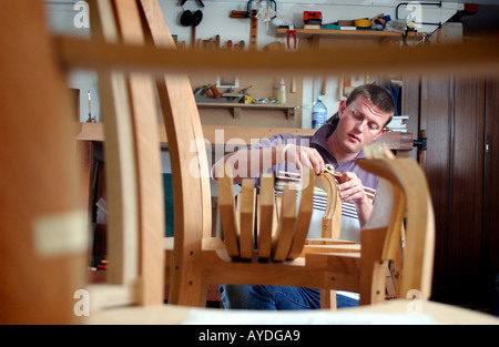 a cabinet maker using tools and working in his studio Stock Photo