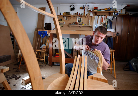 a cabinet maker using tools and working in his studio Stock Photo