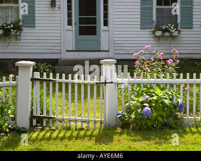 A white picket fence at a rural New England country house Stock Photo