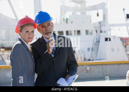 Engineers at harbour Stock Photo