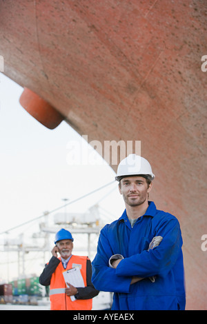Workers by ship Stock Photo