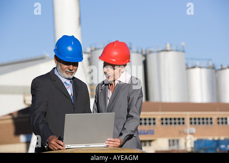 Engineers with laptop Stock Photo