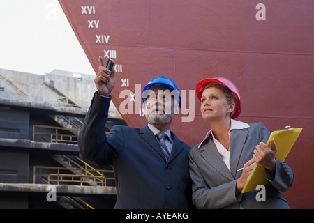 Engineers by ship Stock Photo