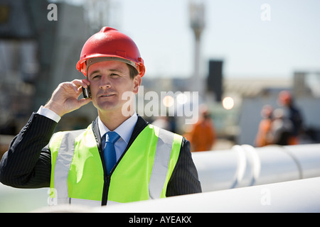 Engineer on cellphone Stock Photo