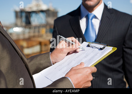 Engineers at harbour Stock Photo