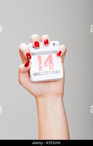 Beautiful young woman holding a Valentines Day heart Stock Photo - Alamy