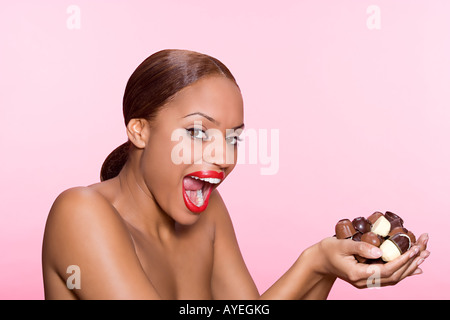 Young woman with chocolates Stock Photo