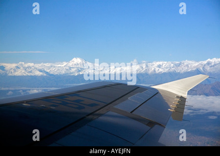 View out the window of an airplane of the Andes Mountain Range Argentina Stock Photo
