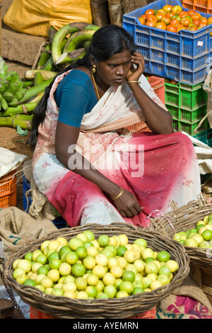 Woman Talking on her Mobile Phone in a Vegetable Market in Madurai South India Stock Photo