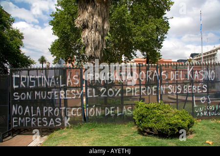 Protest graffiti on a fence in front of the Casa Rosada in Buenos Aires Argentina Stock Photo