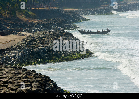 Fishermen in Boat on the Beach in Varkala India Stock Photo