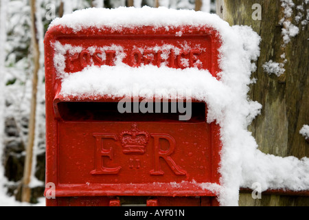 Royal Mail red letter box covered in snow Stock Photo