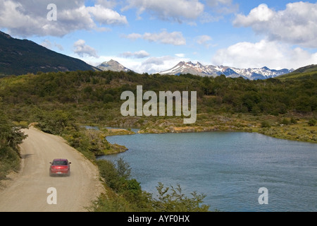 Car on a dirt road in the Tierra del Fuego National Park Argentina Stock Photo