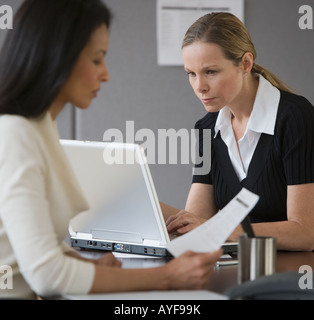 Multi-ethnic businesswomen working in office Stock Photo