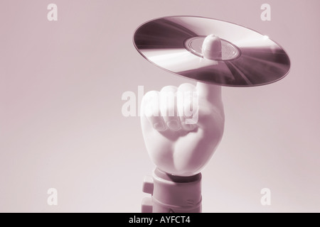 Toy Hand Holding CD Stock Photo