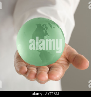 Hand holding globe Stock Photo