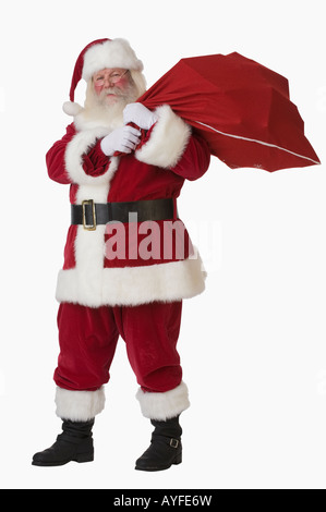 Santa Claus holding bag of toys Stock Photo