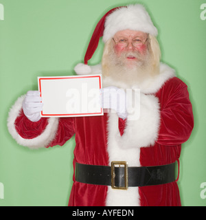 Santa Claus holding blank green sign Full Length Portrait. Isolated on ...