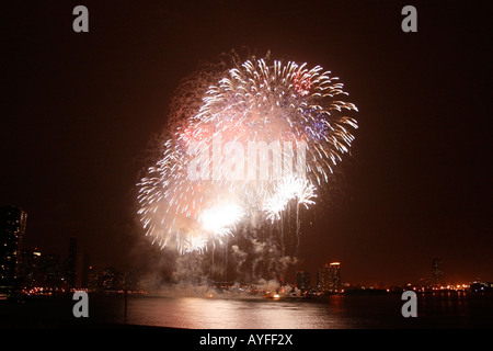 Fireworks exploding in the night sky Stock Photo