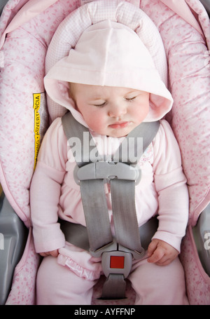 Baby sleeping in car seat Stock Photo