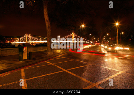 Fast moving nightime rushhour London city traffic on the river Thames Embankment Stock Photo