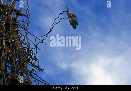 Land diver jumps from wooden tower tied only by vines to his ankles at Pangi on Pentecost Island in the Vanuatu Island Group Stock Photo