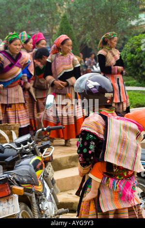 Flower Hmong Woman Wearing a Protective Motorcycle Helmet Bac Ha Market near Sapa Vietnam Stock Photo