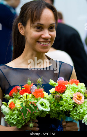 Bridesmaid holding the Flowers and smiling Stock Photo