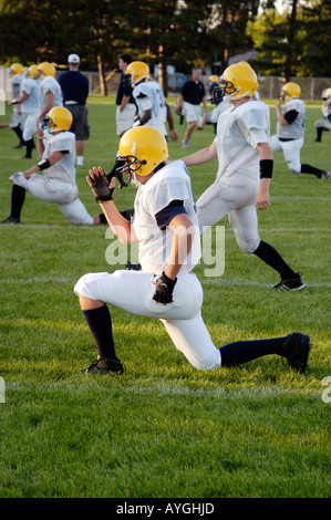 Football players warm up with exercises before playing in a game Stock Photo