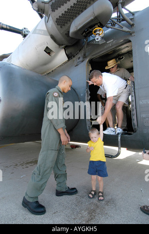 Soldier helping civilian at the Air Show at Selfridge Air Force Base Mt Mount Clemens Michigan MI Stock Photo