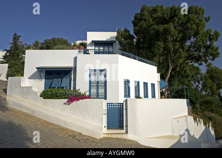 Whitewashed home with blue trim and lilac bougainvillea Sidi Bou Said village Tunisia