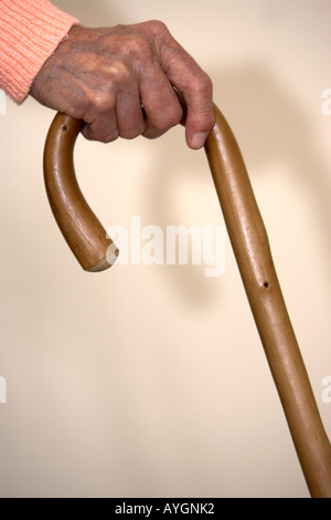 Elderly womans arthritic hand on walking stick retirement accommodation England Stock Photo