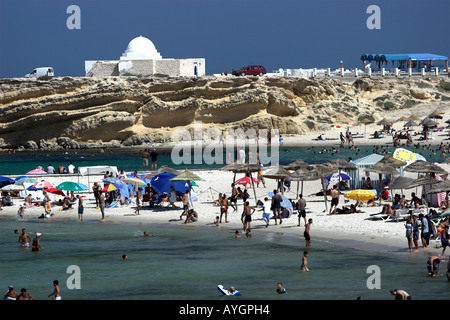 Holidaymakers bathe and cool off at Monastir Beach Tunisia Stock Photo
