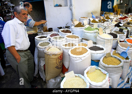 Spices grain and pulses for sale in sacks Sousse Medina Tunisia Stock Photo