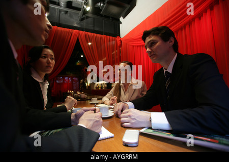 Four businesspeople having meeting Stock Photo