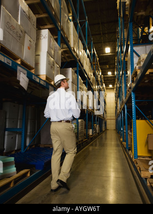 Warehouse worker checking inventory Stock Photo