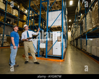 Warehouse workers checking inventory Stock Photo