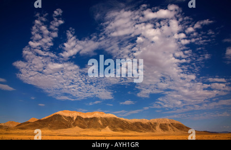 Clouds in blue sky over mountain, Namib Desert, Namibia, Africa Stock Photo