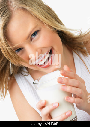 Woman holding glass of milk Stock Photo