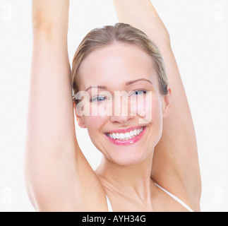 Woman Stretching Arms Over Head Stock Photo Alamy