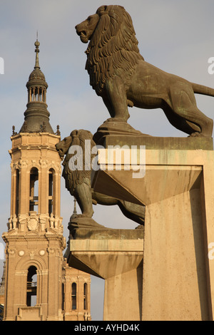 Lion Entrance to Puente de Piedra Bridge with the Basilica de Nuestra Senora del Pilar in the background, Zaragoza, Spain Stock Photo