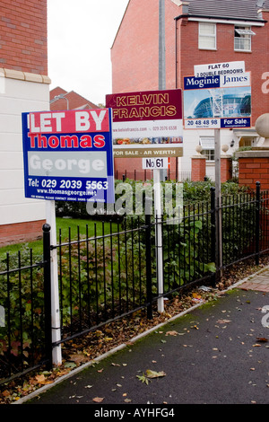 Estate agents' boards outside fairly new flats, Penylan, Cardiff, UK Stock Photo