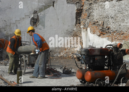 Men working on a building site in Beijing China Stock Photo