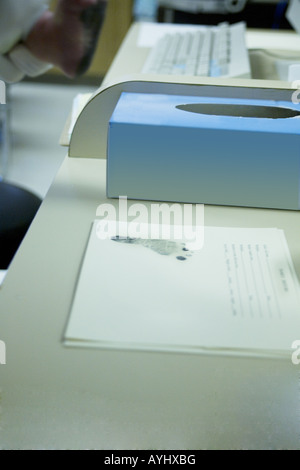 A baby's footprint being put on a certificate in the hospital after childbirth. Stock Photo