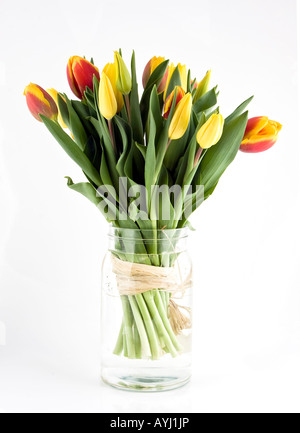 Bunch of tulips in av vase of glass Stock Photo
