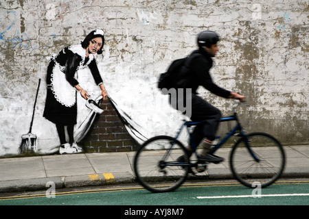 Banksy Maid Sweeping it Under the Carpet, Chalk Farm, London Stock Photo