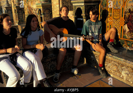 Seville plaza espana youth making music Stock Photo