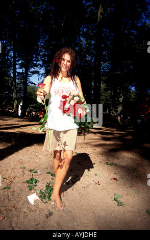 A girl selling roses at the Skanderborg summer music festival Stock Photo