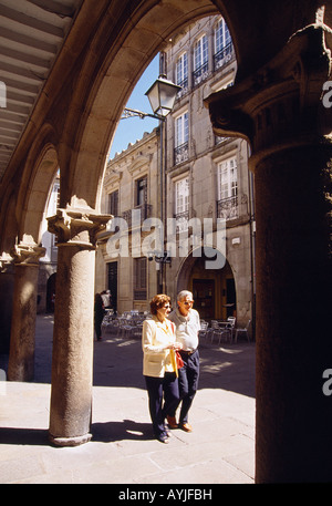 Two people walking along Rua del Villar street. Santiago de Compostela. La Coruña province. Galicia. Spain. Stock Photo