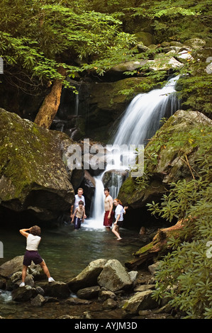 Family Having Photo Taken In Cascade Below Grotto Falls Roaring Fork Motor Nature Trail Great Smoky Mountains National Park Stock Photo